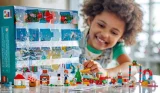 A child playing with a LEGO Advent calendar