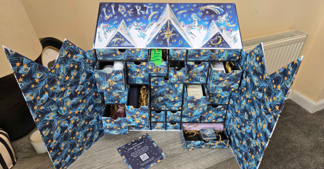 A birdseye view of the 2026 Liberty Beauty Advent Calendar with some drawers opened