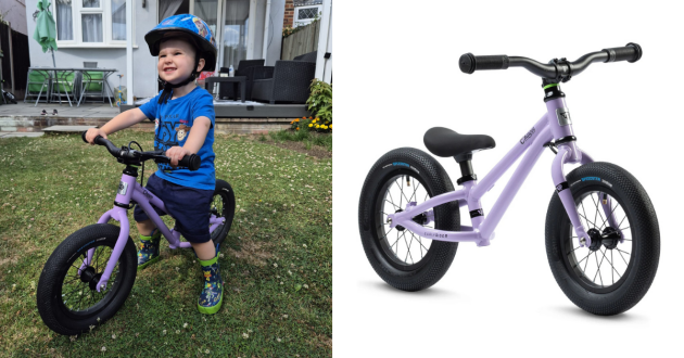 little boy sitting on Early Rider 12" balance bike