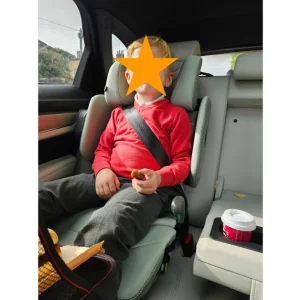 little boy sitting in Axkid Up