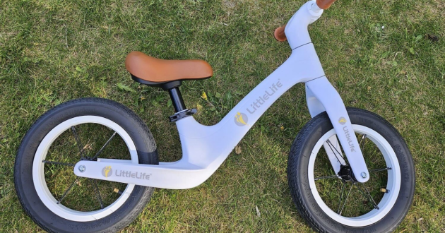 LittleLife Balance Bike lying on grass