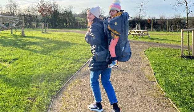 Mum using the LittleLife Pathseeker child carrier