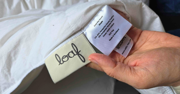 A close up of the Loaf Easy Kip Duvet single care label