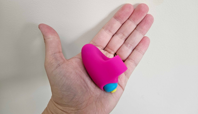 A hand holding the Lovehoney Excite 10 Function Finger Vibrator