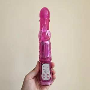 A hand holding the Lovehoney Jessica Rabbit 10 Function Rabbit Vibrator