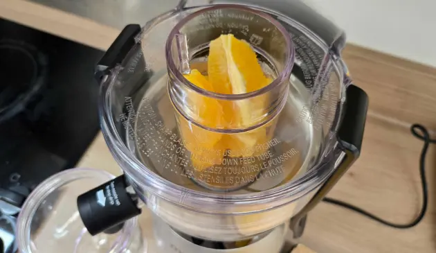 Oranges being put inside the magic bullet Mini Juicer