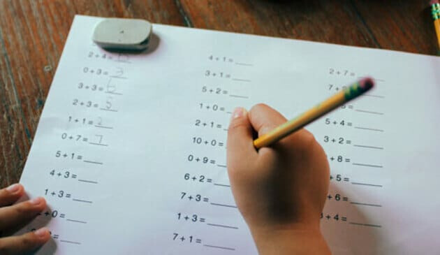 child doing maths homework