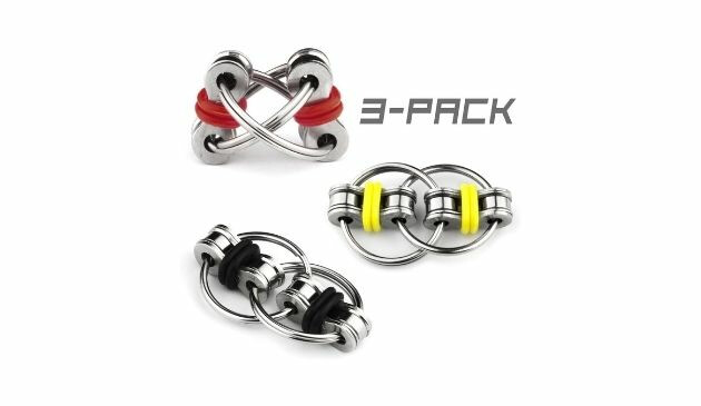 Three metal flippy chain fidget toys. One has black bands, one has yellow bands, one has red bands