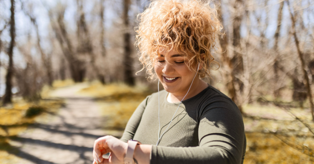 A woman wearing a fitness watch