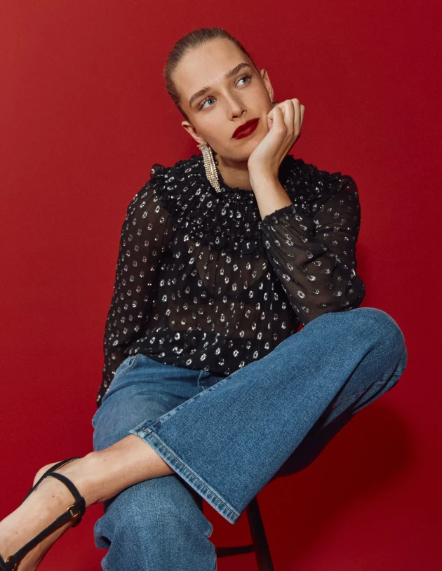 A model wears Boden's Metallic Ruffle Collar Top