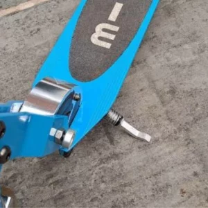 A close up of the kick-stand on the Micro Sprite scooter