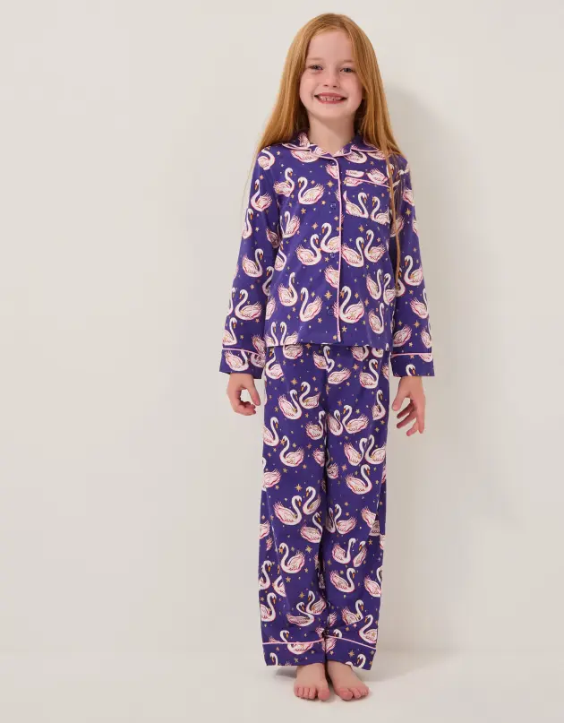 A model wears Monsoon's Swan Print Long Pyjamas Set Blue pyjamas