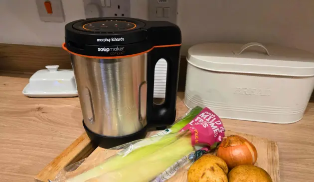 Morphy Richards Compact Soup Maker stainless steel design on kitchen worktop with bread bin and fresh produce
