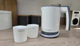 Morphy Richards compact travel kettle with two included cups on kitchen counter