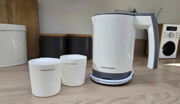 Morphy Richards compact travel kettle with two included cups on kitchen counter
