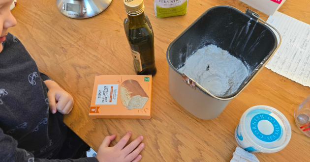 A child helps make bread with the Morphy Richards fastbake breadmaker