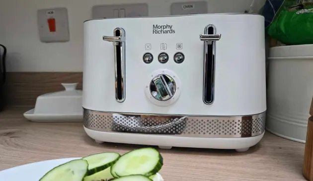 A view of the Morphy Richards Illumination Kettle atop a kitchen surface next to cucumber