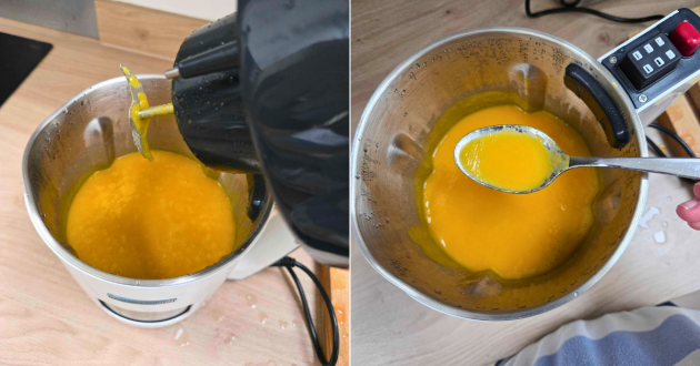 Blending smooth golden soup inside stainless steel jug using stick attachment and ladling creamy finished soup from soup maker