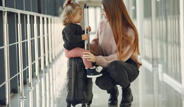 Mother and daughter at an airport