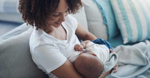 Mother breastfeeding newborn