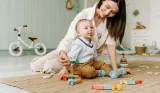 mum and baby playing with toys