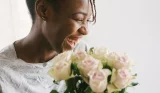 A woman holding a bunch of flowers