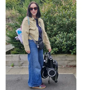 mum holding SmarTrike wonder max stroller trike