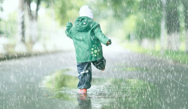 child in puddle