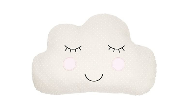 A cloud shaped cushion with a sleepy face