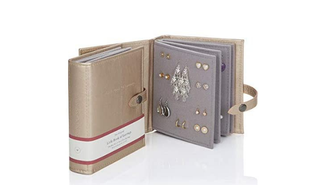 a gold book for storing earrings