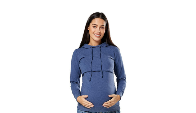 a pregnant woman posing in a blue hoodie