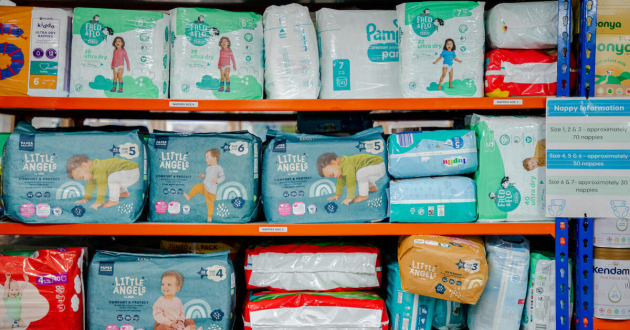 Shelves of nappies at a baby bank