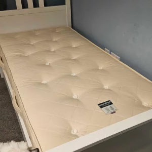 Naturalmat natural teen mattress review image showing close up of mattress on single bed