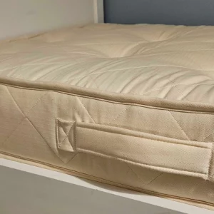Naturalmat Natural Teen Mattress review image showing close up of mattress in testing