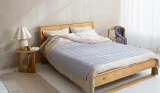 Best mattress hero image: a bed in a neutrally decorated bedroom
