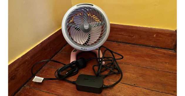 Mumsnet home editor Poppy O'Neill testing the Shark FlexBreeze HydroGo Pro Misting Fan
