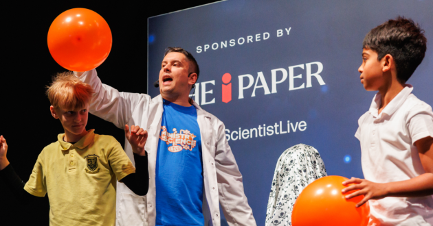 Man and two children on stage at New Scientist Live