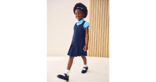 Girl in NEXT pinafore dress