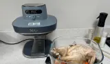 The Ninja Crispi Pro with a full chicken before cooking
