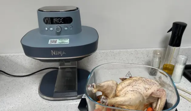 The Ninja Crispi Pro with a full chicken before cooking