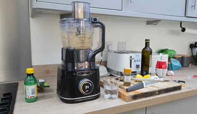 A testing image of the Ninja Detect Power Blender and Processor while it makes hummus