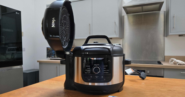 A view of the Ninja 9-in-1 with the Crisping lid up, and pressure lid on