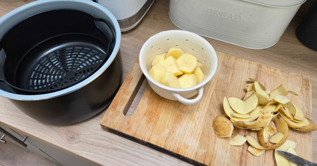 Prepping roast potatoes to go in the Ninja Foodi 9-in-1 Multi Cooker