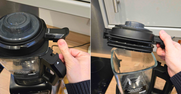 The Ninja Foodie Blender and Soup Maker's lid lock, with a hand showing how to open it