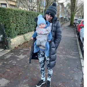 Mum using Nuna CUDL Clik carrier