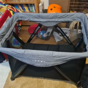 Nuna Sena Aira travel cot assembled in living room