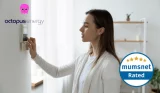 A woman adjusting her thermostat with logos for Octopus Energy and Mumsnet Rated