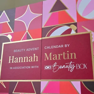 Closed OK! Beauty Advent Calendar 2026 by Hannah Martin, decorated with pink, burgundy and gold festive shapes
