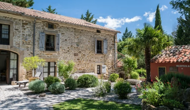A front view of the Old Dairy at Country Kids in the South of France in the sunshine