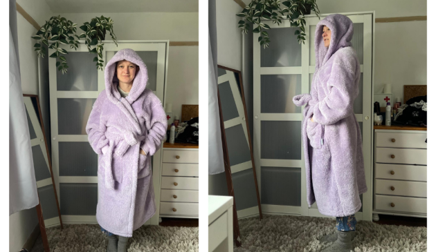 A woman wearing a lilac oodie dressing gown from the front and side